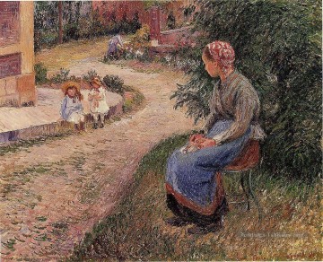  camille - une servante assise dans le jardin d’eragny 1884 Camille Pissarro